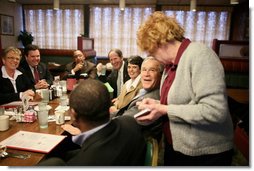 President George W. Bush speaks with a waitress taking his breakfast order Tuesday morning, Jan. 30, 2007, during a breakfast meeting with small business leaders at The Sterling Family Restaurant in Peoria, Ill.  White House photo by Paul Morse