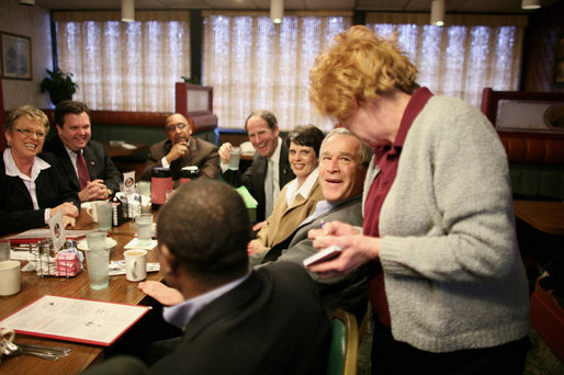 President George W. Bush speaks with a waitress taking his breakfast order Tuesday morning, Jan. 30, 2007, during a breakfast meeting with small business leaders at The Sterling Family Restaurant in Peoria, Ill. White House photo by Paul Morse