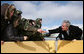 President George W. Bush reaches to shake hands and greet members of the Illinois Air National Guard and their families Tuesday, Jan. 30, 2007, prior to leaving Peoria, Ill. White House photo by Paul Morse