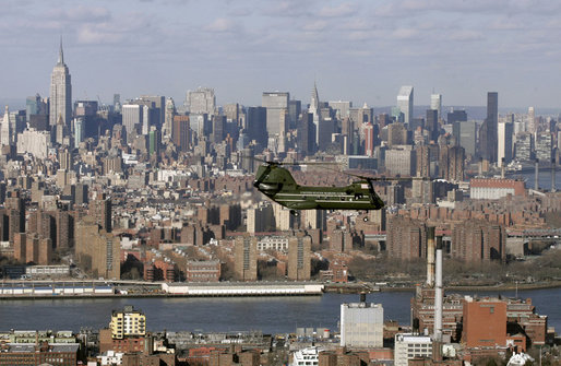 The New York City skyline looms in the background as a helicopter carrying White House staff heads to John F. Kennedy International Airport Wednesday, Jan. 31, 2007. White House photo by Paul Morse