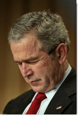 President George W. Bush bows his head in prayer at the National Prayer Breakfast in Washington, D.C., Thursday, Feb. 1, 2007.  White House photo by Eric Draper