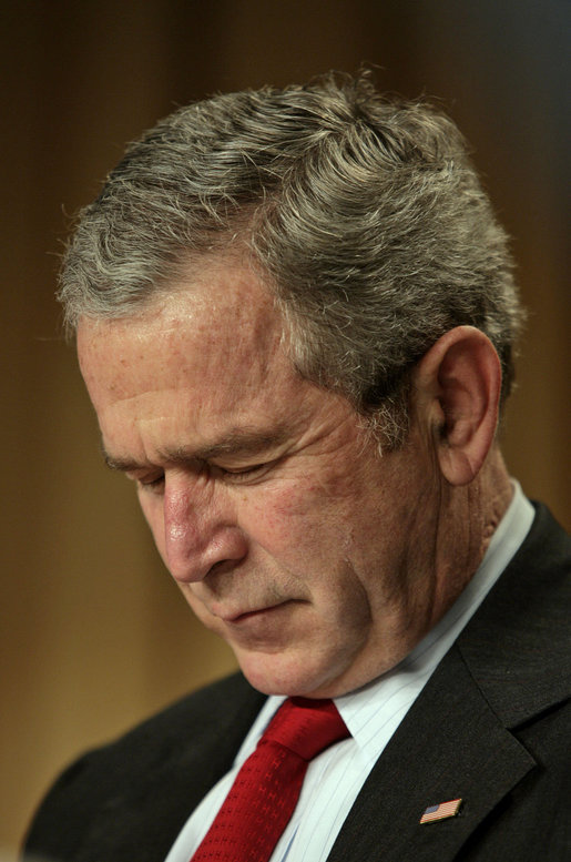 President George W. Bush bows his head in prayer at the National Prayer Breakfast in Washington, D.C., Thursday, Feb. 1, 2007. White House photo by Eric Draper