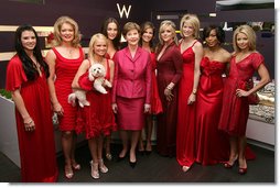 Mrs. Laura Bush joins celebrity models participating in the Red Dress Collection Celebrity Fashion Show Friday, Feb. 2, 2007, during Fashion Week in New York to raise awareness of heart disease and the importance of heart health for women. Standing with Mrs. Bush are, from left: Danica Patrick, Mary Hart, Kristin Chenoweth, Camilla Belle, Natalie Morales, Jane Krakowski, Paula Zahn, Angela Bassett and Kelly Ripa. White House photo by Shealah Craighead