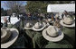 Rangers from the National Park Service wave to President George W. Bush and Laura Bush as they depart for Shenandoah National Park where the President discusses his National Park Centennial Initiative. The Initiative provides for the potential of up to a $3 billion infusion of new funds over the next ten years on top of appropriations for normal operations. "The funding starts with a billion-dollar request over the next 10 years that I'll send up to Congress," said President Bush of the largest ever increase for park operations. White House photo by Eric Draper