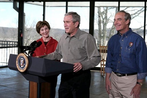 President George W. Bush addresses the press during a visit to Shenandoah National Park in Luray, Va., with Mrs. Laura Bush and Interior Secretary Dirk Kempthorne Wednesday, Feb. 7, 2007. "It is one thing to talk; it's another thing to act," said President Bush. "And I've just submitted a budget to the United States Congress. In it we've got a billion dollars new money for operating expenses." White House photo by Paul Morse