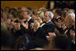 President George W. Bush and Mrs. Laura Bush applaud singer Yolanda Adams in the East Room during a dinner held in honor of the Ford’s Theatre Abraham Lincoln Bicentennial Celebration Sunday, Feb. 11, 2007. "We are here tonight to remember the life -- the incredible life -- and the great sacrifice of the man who saved our Union," said President Bush. "We remember Abraham Lincoln's eloquence, his wisdom, his unshakeable faith in the enduring truth that we're all created equal." White House photo by Paul Morse