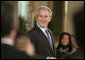 President George W. Bush welcomes guests to the East Room of the White House, Monday, Feb. 12, 2007, for the celebration of African American History Month. White House photo by Paul Morse