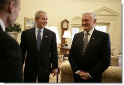 President George W. Bush is introduced to officials accompanying Lithuania's President Valdas Adamkus Monday, Feb. 12, 2007, during the leader's visit to the White House.  White House photo by Eric Draper