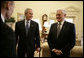 President George W. Bush is introduced to officials accompanying Lithuania's President Valdas Adamkus Monday, Feb. 12, 2007, during the leader's visit to the White House. White House photo by Eric Draper