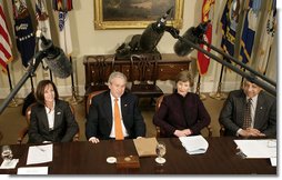 President George W. Bush, joined by Mrs. Laura Bush, talks with reporters during a briefing on volunteerism in the Roosevelt Room at the White House, Tuesday, Feb. 13, 2007, seen with Jean Case, chair of the President’s Council on Service and Civic Participation, and Bob Goodwin, president and CEO of Points of the Light Foundation and Volunteer Center National Network.  White House photo by Eric Draper