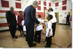 President George W. Bush visits with children at YMCA Anthony Bowen in Washington, D.C., Tuesday, Feb. 13, 2007. White House photo by Eric Draper