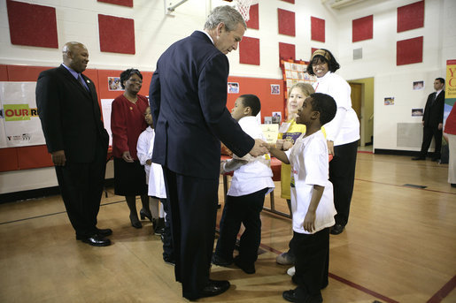 President George W. Bush visits with children at YMCA Anthony Bowen in Washington, D.C., Tuesday, Feb. 13, 2007. White House photo by Eric Draper