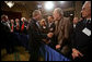 President George W. Bush greets audience members after addressing the American Enterprise Institute in Washington, D.C., Thursday, Feb. 15, 2007. "I recently announced a new strategy for Iraq -- it's a plan that demands more from the Iraqi government," said President Bush in his speech. "Not only do we demand more from the Iraqi government, but so do the Iraqi people demand more from the Iraqi government. They want to live in peace." White House photo by David Bohrer