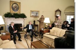 President George W. Bush talks with the press during a meeting with Ambassador Ryan Crocker, Ambassador-Designee to Iraq, in the Oval Office Friday, Feb. 16, 2007.  White House photo by Eric Draper