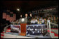 Vice President Dick Cheney waves in response to a welcome Wednesday, Feb. 21, 2007, from troops aboard the USS Kitty Hawk at Yokosuka Naval Base in Japan. White House photo by David Bohrer