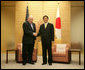 Vice President Dick Cheney stands with Prime Minister of Japan Shinzo Abe before a meeting Wednesday, Feb. 21, 2007, at the Kantei, the official residence of the Prime Minister, in Tokyo. White House photo by David Bohrer