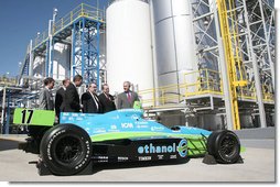 President George W. Bush is joined by officials from Novozymes North America, Inc. Wednesday, Feb. 22, 2007, as he is shown a race car that is fueled by ethanol, during his tour of the Novozymes, a biotechnology facility in Franklinton, N.C. White House photo by Paul Morse