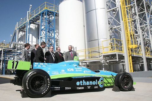 President George W. Bush is joined by officials from Novozymes North America, Inc. Wednesday, Feb. 22, 2007, as he is shown a race car that is fueled by ethanol, during his tour of the Novozymes, a biotechnology facility in Franklinton, N.C. White House photo by Paul Morse