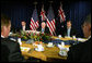 Vice President Dick Cheney is flanked by Tony Abbott, left, Australian Minister for Health and Ageing, and Robert McClelland, Shadow Minister for Foreign Affairs, during a breakfast meeting Friday, Feb. 23, 2007, at the Shangri-La Hotel in Sydney. White House photo by David Bohrer