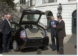 President George W. Bush takes part in a demonstration of alternative fuel automobiles on the South Lawn of the White House Friday, Feb. 23, 2007. "But I firmly believe that the goal I laid out, that Americans will use 20 percent less gasoline over the next 10 years is going to be achieved, and here's living proof of how we're going to get there," said the President.  White House photo by Paul Morse