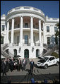 President George W. Bush talks to the press at a demonstration of alternative fuel automobiles on the South Lawn of the White House Friday, Feb. 23, 2007. "We're going to be driving our cars using all kinds of different fuels other than gasoline, and using batteries that will be able to be recharged in vehicles that don't have to look like golf carts," said President Bush. White House photo by Paul Morse