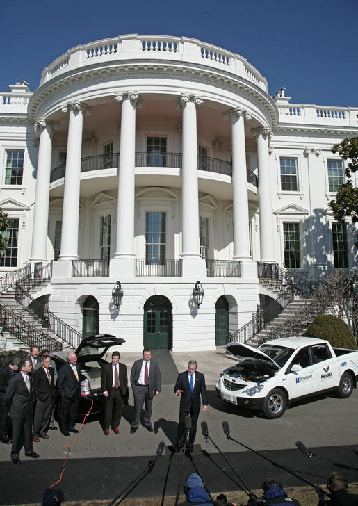 President George W. Bush talks to the press at a demonstration of alternative fuel automobiles on the South Lawn of the White House Friday, Feb. 23, 2007. "We're going to be driving our cars using all kinds of different fuels other than gasoline, and using batteries that will be able to be recharged in vehicles that don't have to look like golf carts," said President Bush. White House photo by Paul Morse