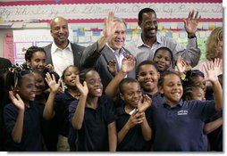 President George W. Bush with New Orleans Mayor Ray Nagin, left, and Dr. Anthony “Tony” Recasner, principal and director of the Samuel J. Green charter school, pose with third grade students for a photo Thursday, March 1, 2007, during President Bush’s visit to the Gulf Coast region to see the continued recovery progress of communities devastated by Hurricane Katrina. White House photo by Eric Draper