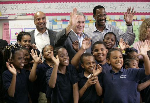 President George W. Bush with New Orleans Mayor Ray Nagin, left, and Dr. Anthony “Tony” Recasner, principal and director of the Samuel J. Green charter school, pose with third grade students for a photo Thursday, March 1, 2007, during President Bush’s visit to the Gulf Coast region to see the continued recovery progress of communities devastated by Hurricane Katrina. White House photo by Eric Draper