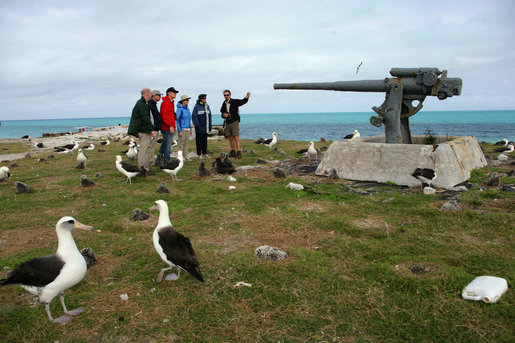 Mrs. Laura Bush views albatross birds and remnants of World War II with wildlife biologist John Klavitter during a tour of Eastern Island on Midway Atoll, part of the Northwest Hawaiian Islands National Monument, Thursday March 1, 2007. Midway Atoll was the site of the Battle of Midway June 4, 1942. The U.S. Navy defeated a Japanese attack against Midway Islands, marking a turning point in the war in the pacific theater. White House photo by Shealah Craighead