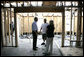 President George W. Bush talks with Cheryl Woodward of Long Beach, Miss. and a construction worker, Thursday, March 1, 2007, during the President’s tour of the neighborhood where homes damaged by Hurricane Katrina have been rebuilt with Gulf Coast grant money. White House photo by Eric Draper