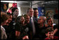 With Mrs. Laura Bush looking on, President George W. Bush poses for a photo Friday, March 9, 2007, with students at Meninos do Morumbi, a center for young people in Sao Paulo that teaches musical skills as an alternative to drugs and crime. White House photo by Paul Morse