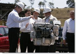 President George W. Bush and President Luiz Inacio Lula da Silva participate in a demonstration Friday, March 9, 2007, at the Petrobras Transporte S.A. Facility in Sao Paulo. With them is Sergio Gabrielle, chief executive officer of Petrobras. "One of the things I like, as the President (Luiz Inacio Lula da Silva) noted, is that a good ethanol policy and good alternative fuel policy actually leads to more jobs, not less," said President Bush during his remarks at the fuel facility. White House photo by Paul Morse