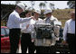 President George W. Bush and President Luiz Inacio Lula da Silva participate in a demonstration Friday, March 9, 2007, at the Petrobras Transporte S.A. Facility in Sao Paulo. With them is Sergio Gabrielle, chief executive officer of Petrobras. "One of the things I like, as the President (Luiz Inacio Lula da Silva) noted, is that a good ethanol policy and good alternative fuel policy actually leads to more jobs, not less," said President Bush during his remarks at the fuel facility. White House photo by Paul Morse