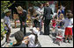 Mrs. Laura Bush talks with a little boy at Projeto Aprendiz Friday, March 9, 2007, in Sao Paolo, Brazil. Developing the concept of the neighborhood as a school, the program supplements school education with a wide range of community-based activities that nurture young people’s creativity and self-esteem. White House photo by Shealah Craighead