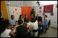 Mrs. Laura Bush talks with program participants of Projeto Aprendiz Friday, March 9, 2007, in Sao Paolo, Brazil. The organization has developed the concept of the neighborhood as a school, the program supplements school education with a wide range of community-based activities. The work carried out by Aprendiz has been recognized by UNICEF as a best practice project to be disseminated worldwide. White House photo by Shealah Craighead