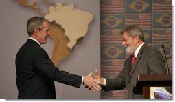 President George W. Bush and Brazil's President Luiz Inacio Lula da Silva shake hands Friday, March 9, 2007, after a joint press availability in Sao Paulo. The two leaders met for the day and discussed many topics, including biofuels, energy, and international affairs. White House photo by Paul Morse