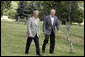 President George W. Bush and President Tabare Vazquez walk to their joint press availability Saturday, March 10, 2007, on the grounds of Estancia Anchorena, the Uruguayan President's retreat. White House photo by Paul Morse