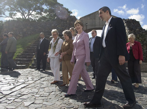 Mrs. Laura Bush joins Mrs. Maria Auxiliadora Delgado de Vazquez, in brown, wife of Uruguay's President Tabare Vazquez, during a walking tour Saturday, March 10, 2007, of the historic Portuguese settlement Colonia del Sacramento. White House photo by Shealah Craighead