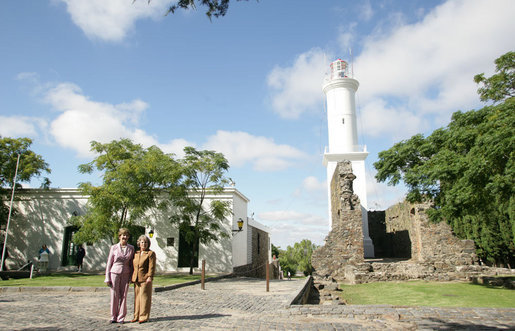 Mrs. Laura Bush and Mrs. Maria Auxiliadora Delgado de Vazquez, wife of Uruguayan President Tabare Vazquez, pause during their walking tour Saturday, March 10, 2007, of historic Colonia del Sacramento, founded in 1680 by Manuel de Lobo. White House photo by Shealah Craighead