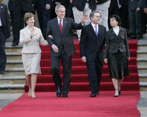 President George W. Bush and Mrs. Laura Bush wave goodbye with President Alvaro Uribe and First Lady Lina Moreno de Uribe of Columbia at the end of their visit to the Presidential Palace in Bogotá, Colombia, Sunday, March 11, 2007. White House photo by Eric Draper