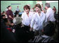 Mrs. Laura Bush and Mrs. Wendy Widmann de Berger, wife of President Oscar Berger of Guatemala, greet villagers Monday, March 12, 2007, at the Carlos Emilio Leonardo School in the Guatemalan village of Santa Cruz Balanya. White House photo by Paul Morse