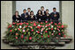 Staff members stand for the playing of the national anthems Monday, March 12, 2007, during the arrival ceremony at the Palacio Nacional de la Cultura in Guatemala City, marking the visit of President George W. Bush and Mrs. Laura Bush to the country. White House photo by Paul Morse