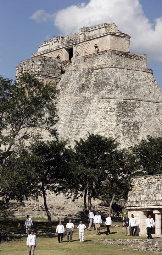 President George W. Bush and President Felipe Calderon of Mexico participate in a tour Tuesday, March 13, 2007, of the Uxmal ruins. Behind them is the Pyramid of the Magician, a 117-feet high structure, which legend holds was built in a single night by a dwarf boy. White House photo by Paul Morse