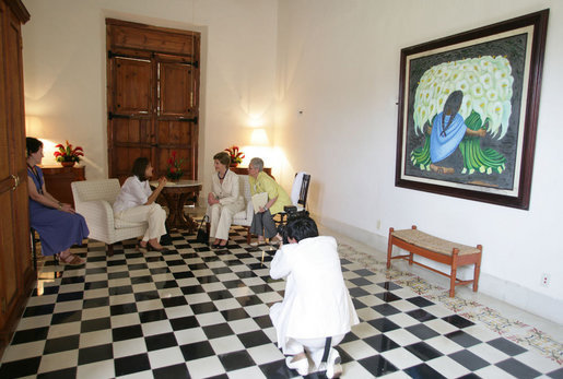 A photographer records a meeting between Mrs. Laura Bush and Mrs. Margarita Zavala, wife of Mexico President Felipe Calderon, during their visit Tuesday, March 13, 2007, in Temozon Sur, Mexico. White House photo by Shealah Craighead