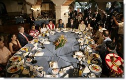 President George W. Bush joins a breakfast meeting with Training, Internships and Scholarships (TIES) recipients Wednesday, March 14, 2007, in Merida, Mexico. White House photo by Eric Draper