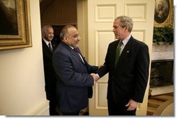 President George W. Bush welcomes Vice President Adil Abd Al-Mahdi of Iraq to the Oval Office Thursday, March 15, 2007. White House photo by Eric Draper