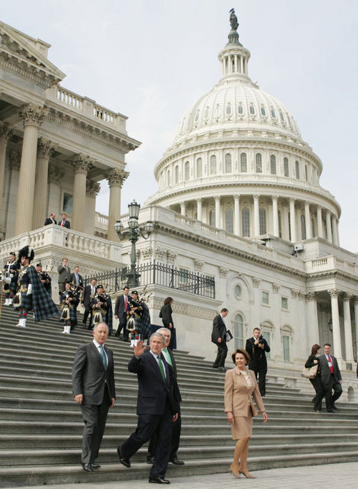 President George W. Bush waves as he leaves the U.S. Capitol with Ireland’s Prime Minister Bertie Ahern, House Speaker Nancy Pelosi, right, and Irish Foreign Minister Dermot Ahern, left, Thursday, March 15, 2007, following the annual St. Patrick’s Day luncheon at the U.S. Capitol. White House photo by Joyce Boghosian