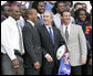 President George W. Bush is joined by University of Florida Gators football coach Urban Meyers, right, and team quarterback Chris Leak during ceremonies at the White House, Monday, March 19, 2007, to honor the 2006 NCAA football championship team. White House photo by Eric Draper