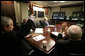 President George W. Bush and Vice President Dick Cheney wave from the Situation Room of the White House Monday, March 19, 2007, as they're joined in a video teleconference by Prime Minister Nouri al-Maliki of Iraq. White House photo by Eric Draper