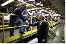 President George W. Bush shakes the hand of an employee at the General Motors Fairfax Assembly Plant Tuesday, March 20, 2007, in Fairfax, Kansas. White House photo by Eric Draper